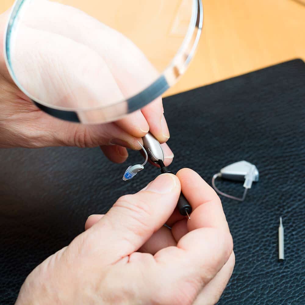 hearing aid acoustician at work